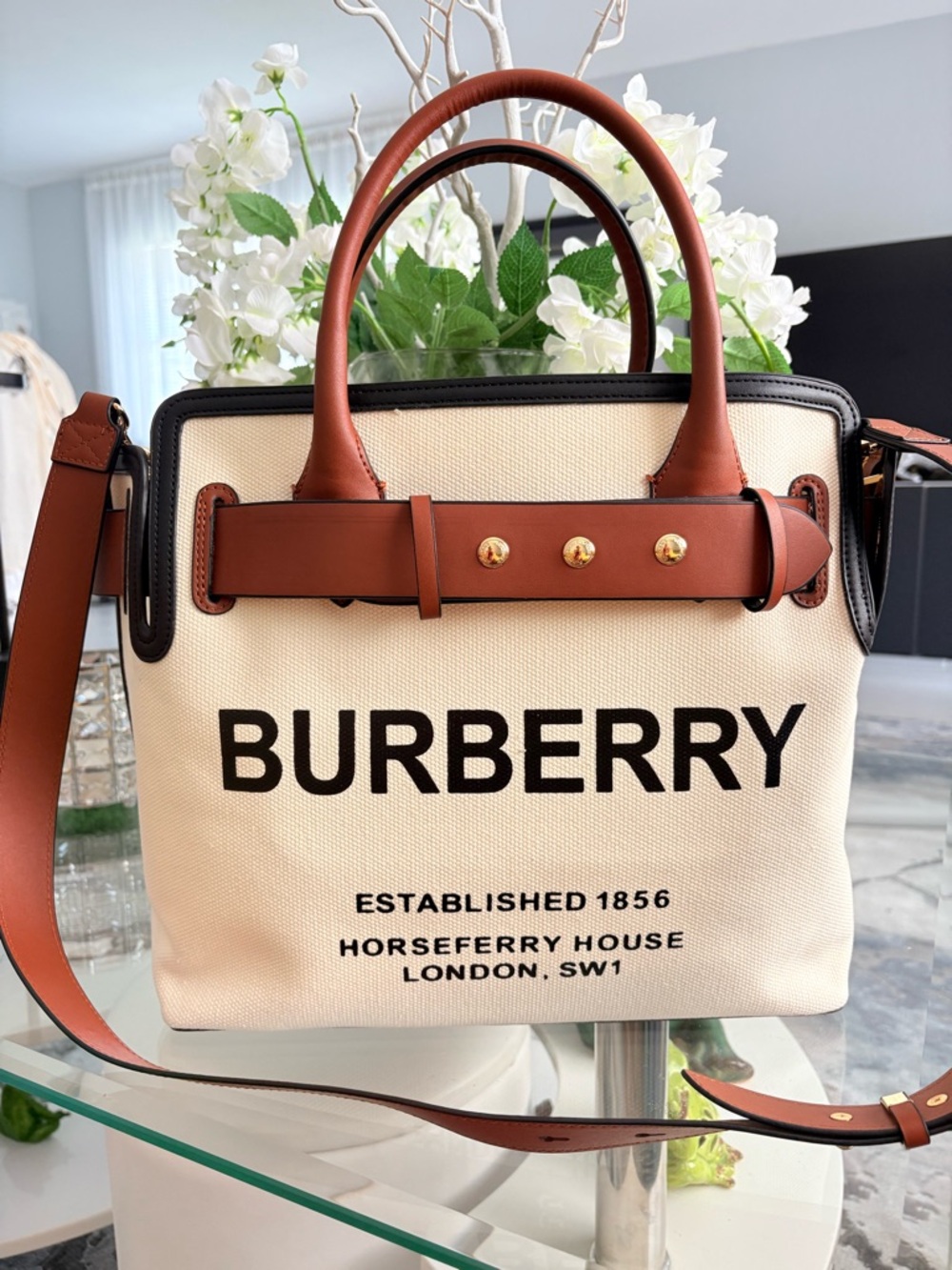 Burberry Cream Canvas Tote with Brown Leather Trim and Black Logo.